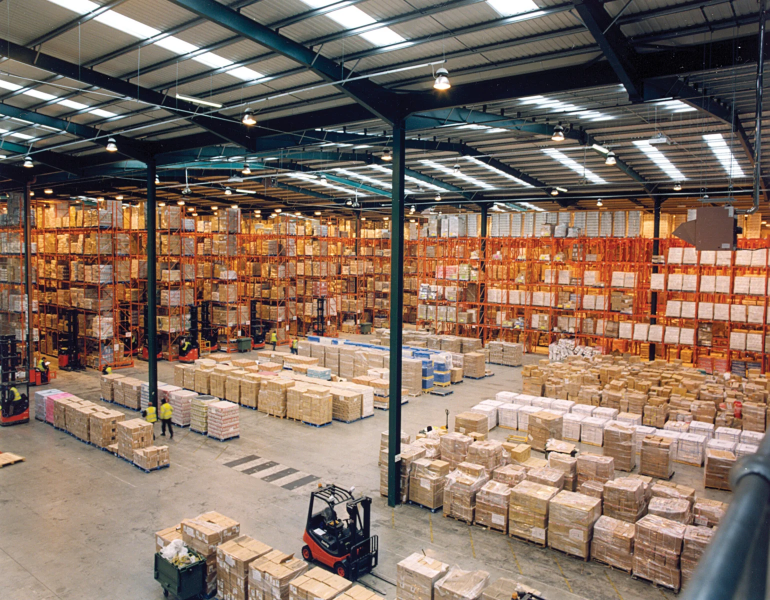 Modern warehouse with pallet racks storing OEM product lines for distribution