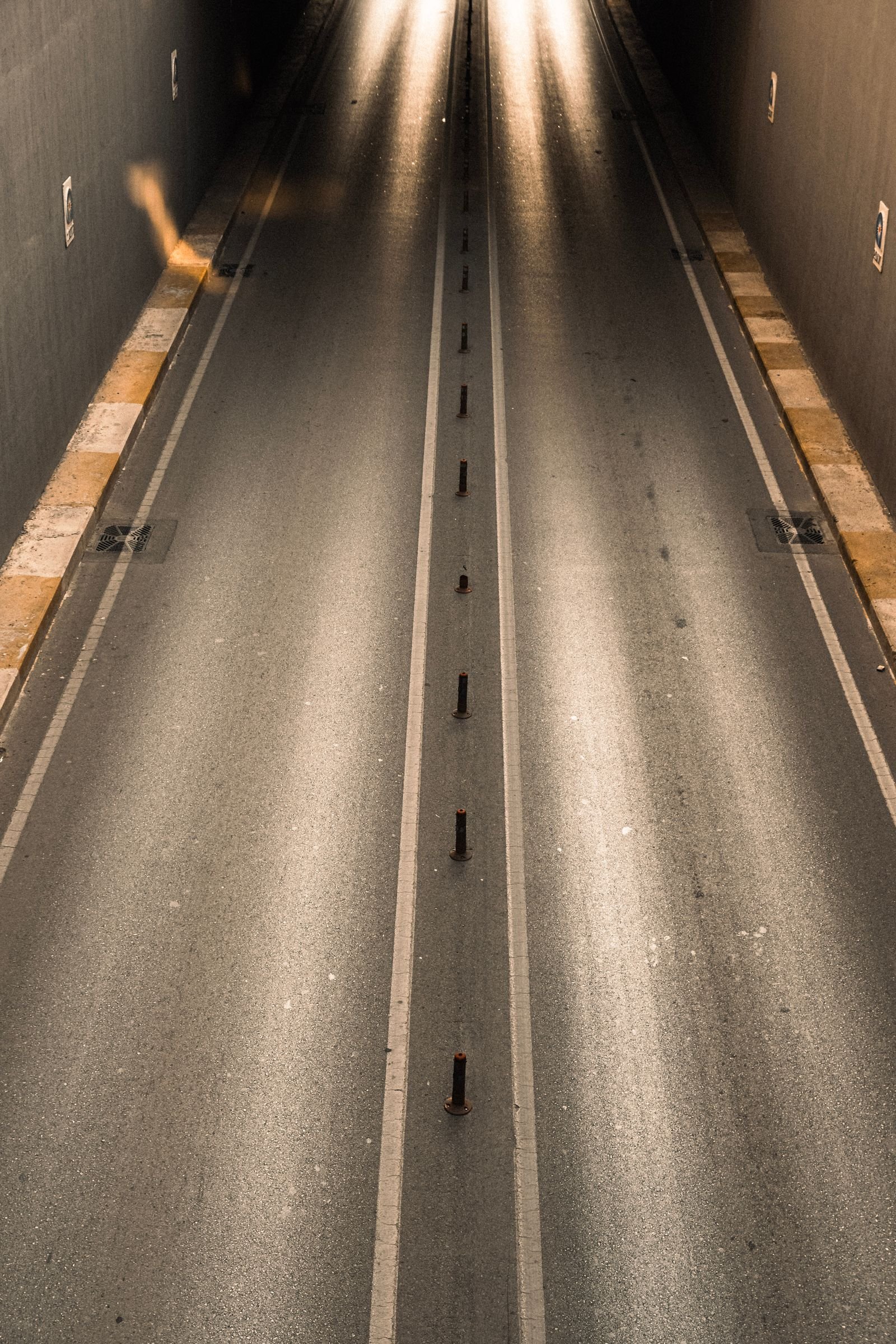 Aerial view of a road tunnel entrance with ambient lighting