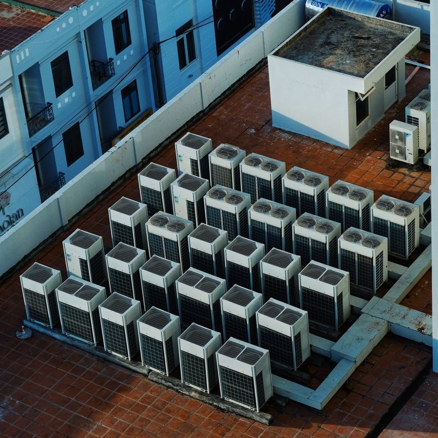 Roof fan discharging through the roof
