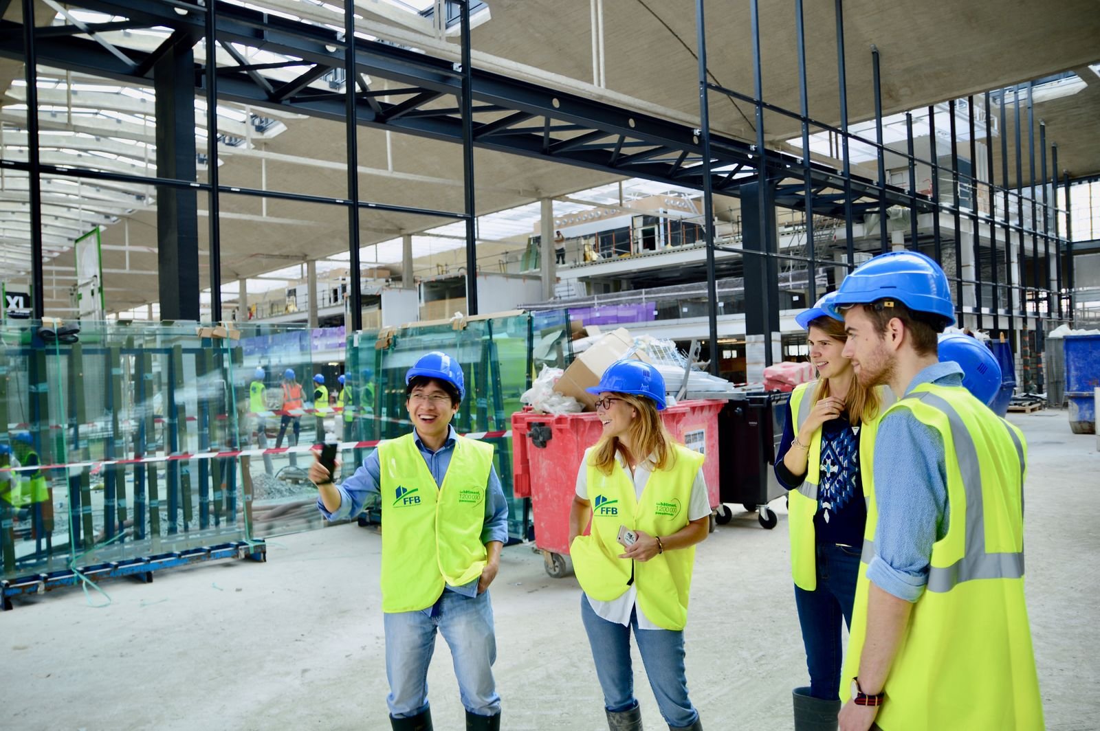 Engineers and contractors discussing HVAC project requirements on site