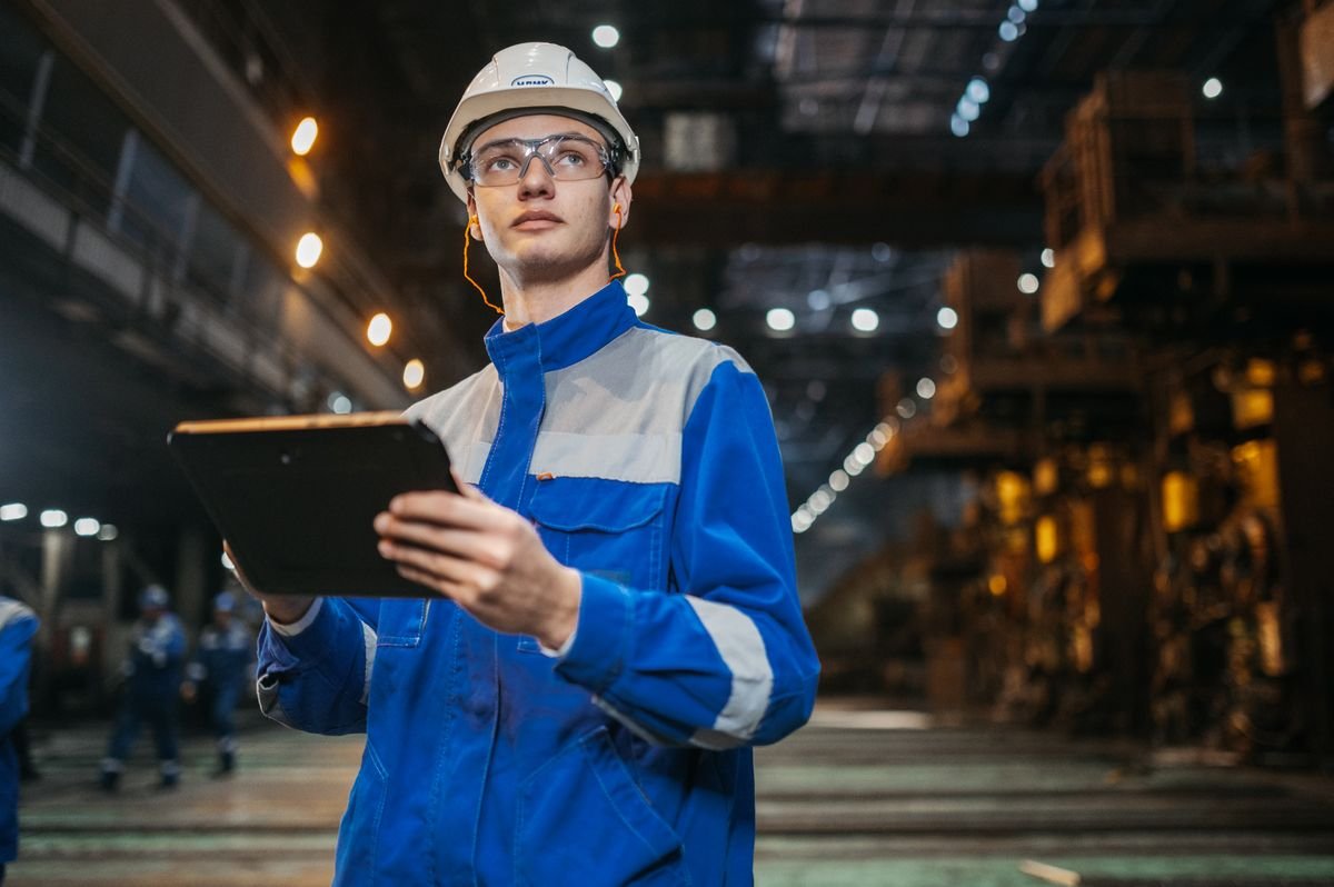 Engineer reviewing HVAC component specifications in an industrial facility