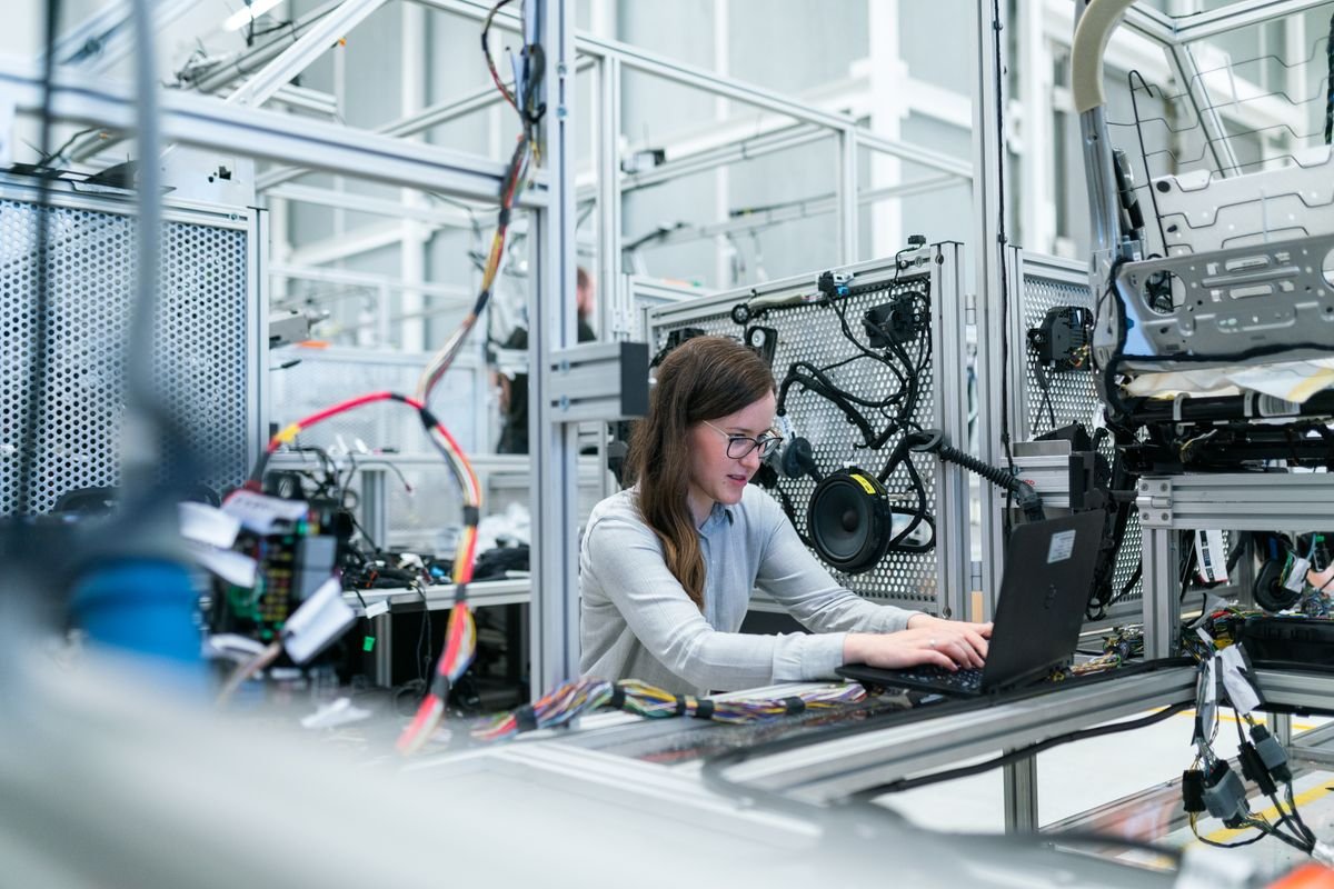 Engineer reviewing technical data sheet performance curves and testing documents