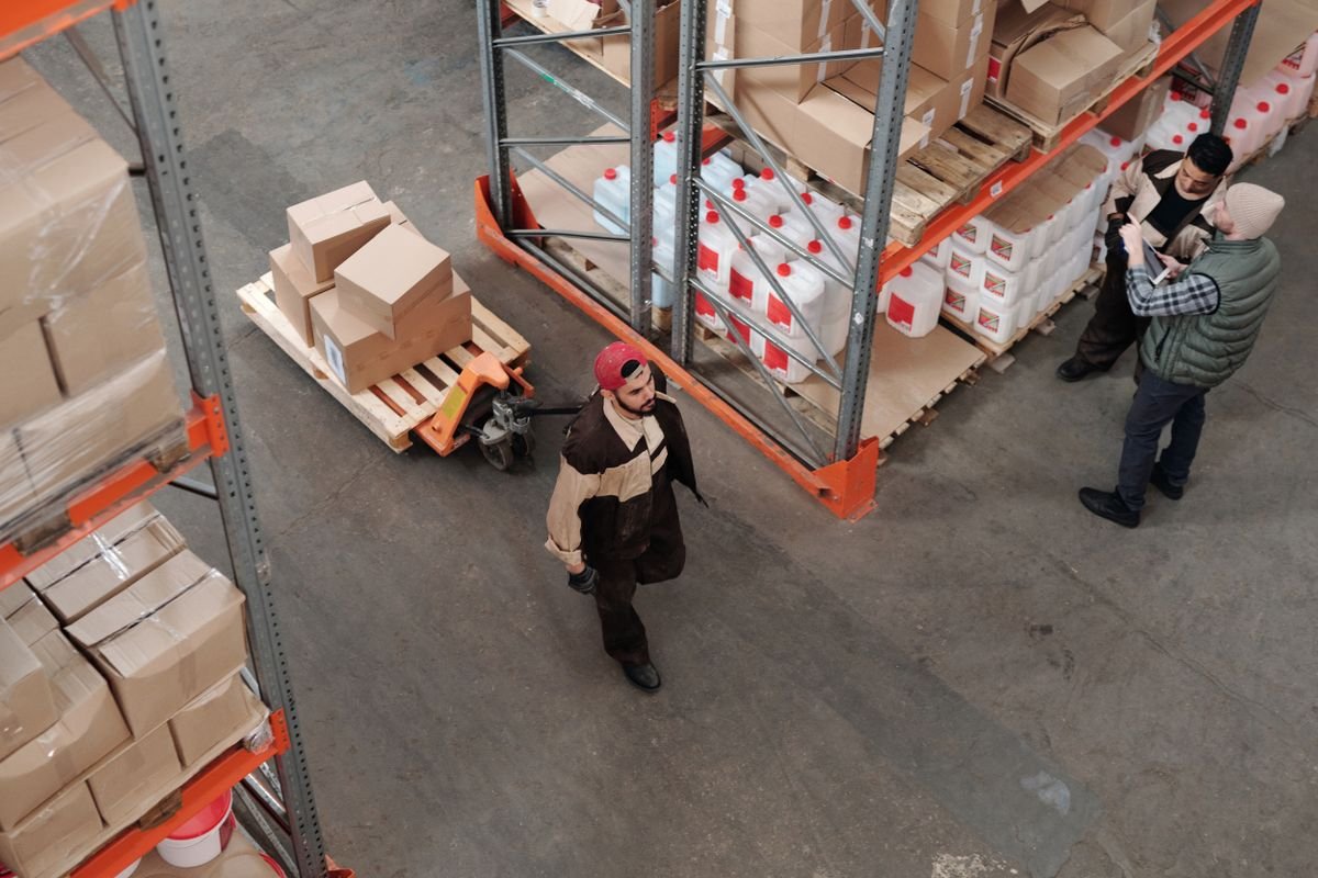 Warehouse team reviewing inventory and shipment preparation