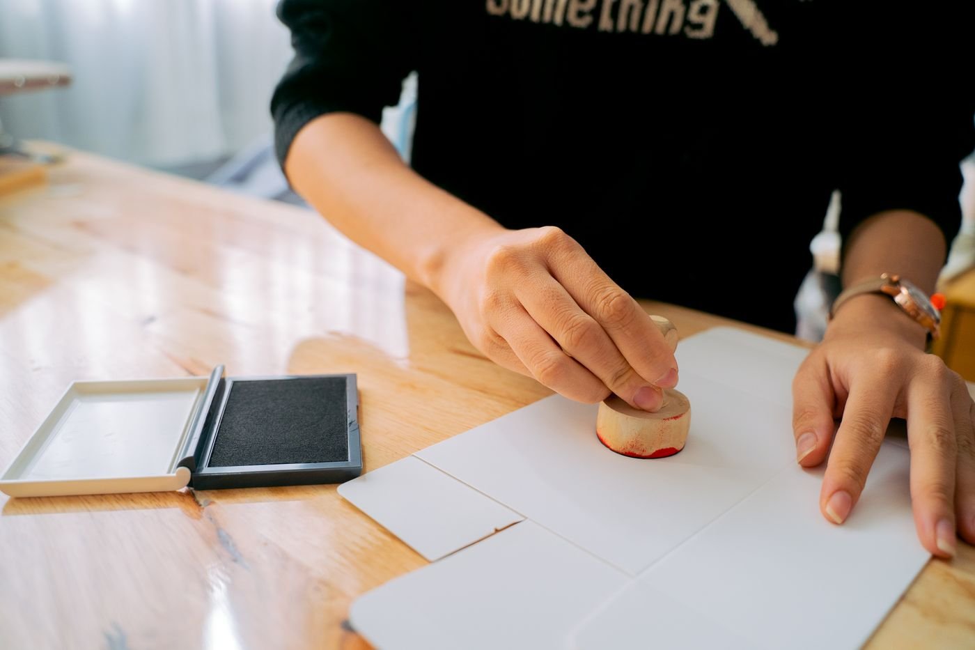 Hand stamping an approval document