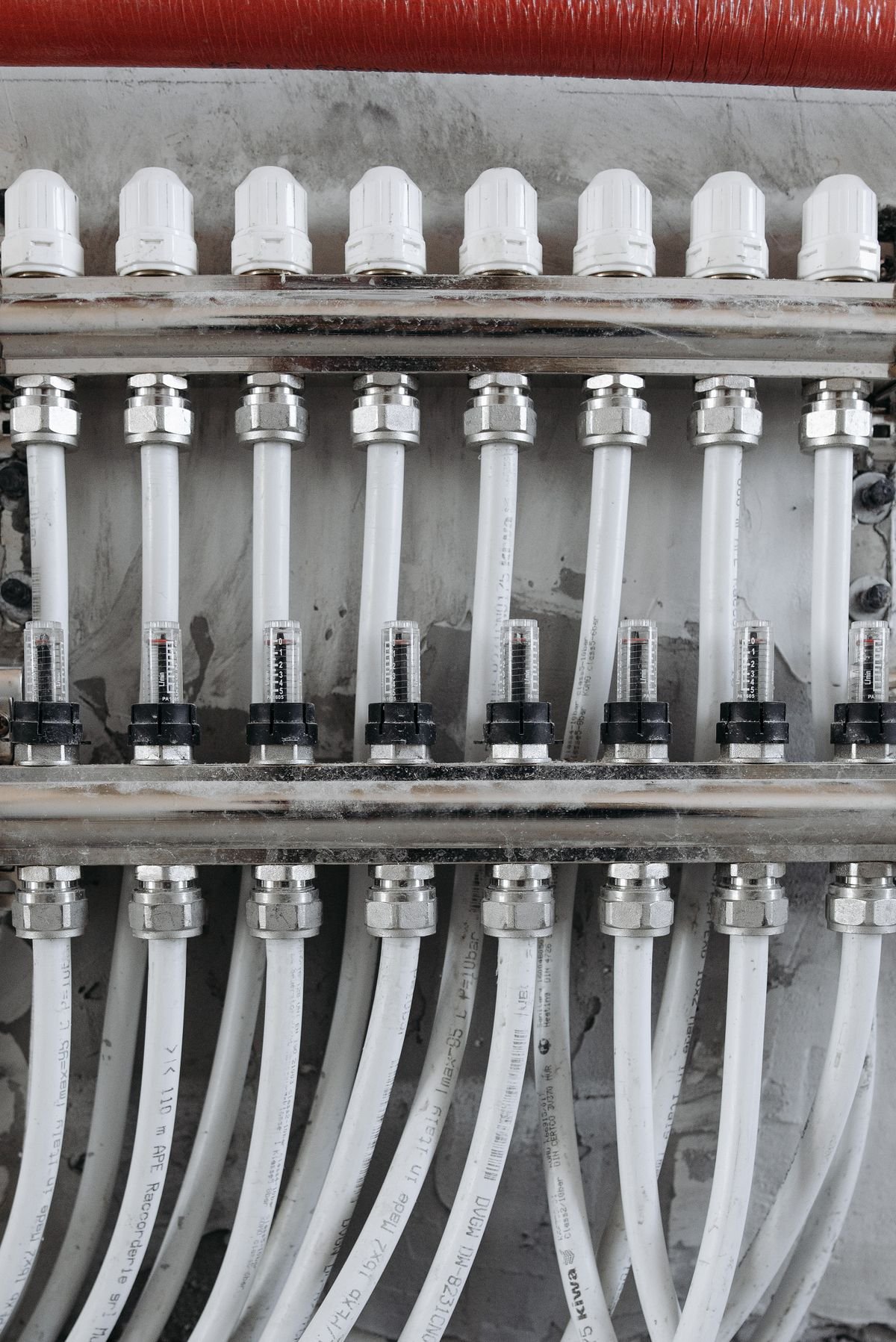 Close-up of industrial pipes with pressure gauges and valves