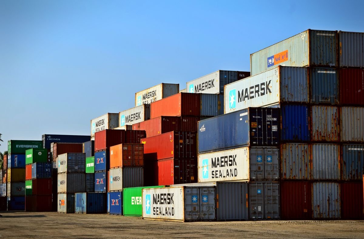 Stacked shipping containers at an industrial port
